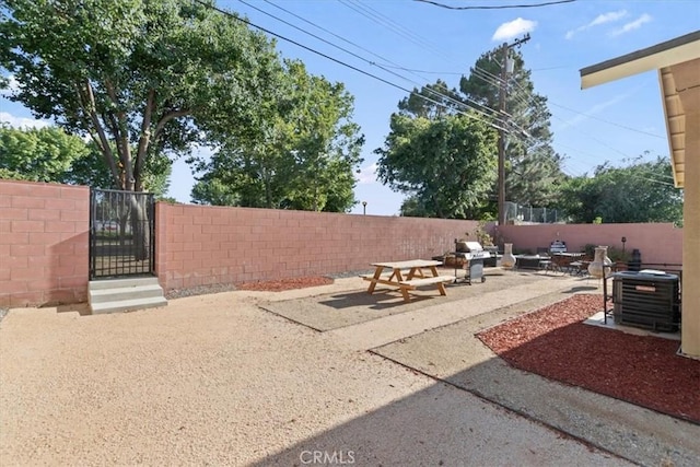 350 E Nugent St, Lancaster, CA 93535 - fenced backyard featuring a gate and a patio