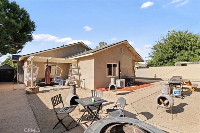 350 E Nugent St, Lancaster, CA 93535 - back of house with stucco siding and a patio area