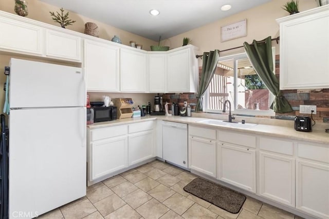 350 E Nugent St, Lancaster, CA 93535 - kitchen featuring white appliances, a sink, white cabinets, light countertops, and decorative backsplash