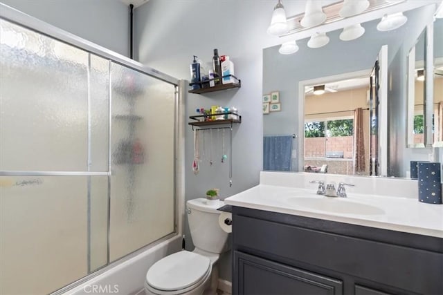 350 E Nugent St, Lancaster, CA 93535 - bathroom featuring toilet, vanity, and shower / bath combination with glass door