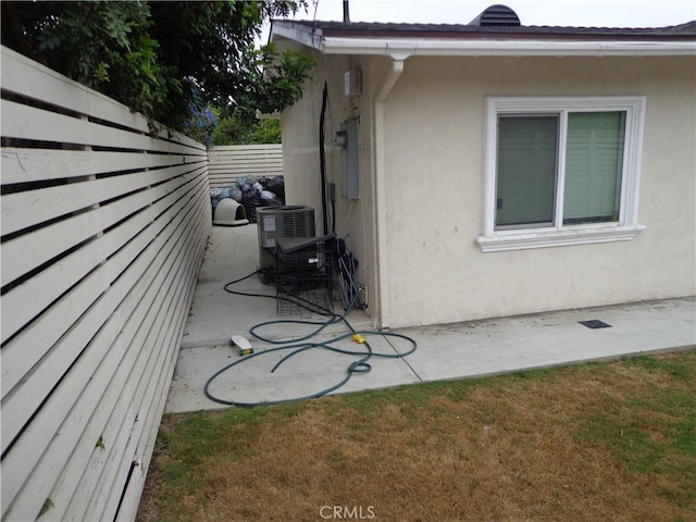 1908 Bailey Ave, Rosemead, CA 91770 - view of side of property with stucco siding, central AC unit, and a patio area