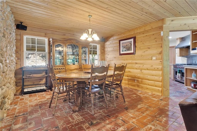 3537 Pinon Pines Rd, Wrightwood, CA 92397 - dining space with brick floors, a chandelier, wooden ceiling, and wood walls