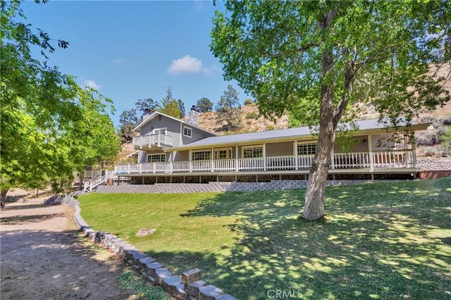 3537 Pinon Pines Rd, Wrightwood, CA 92397 - back of property featuring a lawn, a chimney, and a deck
