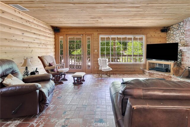 3537 Pinon Pines Rd, Wrightwood, CA 92397 - living area with wooden ceiling, brick floors, and wooden walls