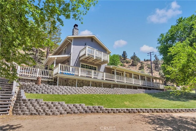 3537 Pinon Pines Rd, Wrightwood, CA 92397 - rear view of property featuring a chimney, a lawn, and a balcony