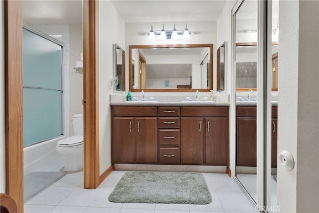 3537 Pinon Pines Rd, Wrightwood, CA 92397 - bathroom featuring toilet, double vanity, tile patterned flooring, and enclosed tub / shower combo
