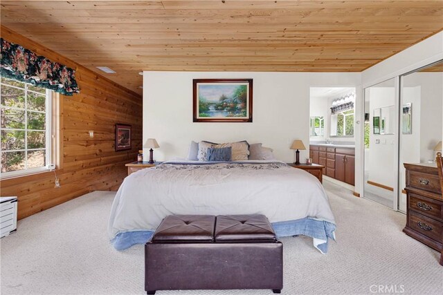 3537 Pinon Pines Rd, Wrightwood, CA 92397 - bedroom with light carpet, wooden ceiling, wood walls, and ensuite bathroom