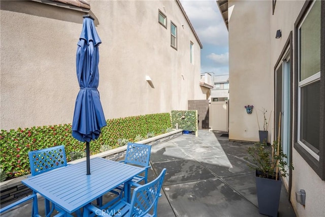 15820 Caterpillar Dr, Fontana, CA 92336 - view of patio / terrace featuring a gate and outdoor dining space