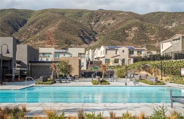 15820 Caterpillar Dr, Fontana, CA 92336 - community pool featuring a mountain view, a residential view, and a patio area