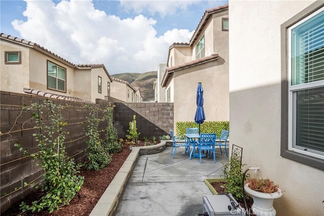 15820 Caterpillar Dr, Fontana, CA 92336 - fenced backyard featuring a patio and outdoor dining area