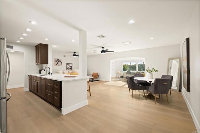 4158 Seri St, San Diego, CA 92117 - kitchen featuring open floor plan, light wood finished floors, dark brown cabinets, light countertops, and recessed lighting
