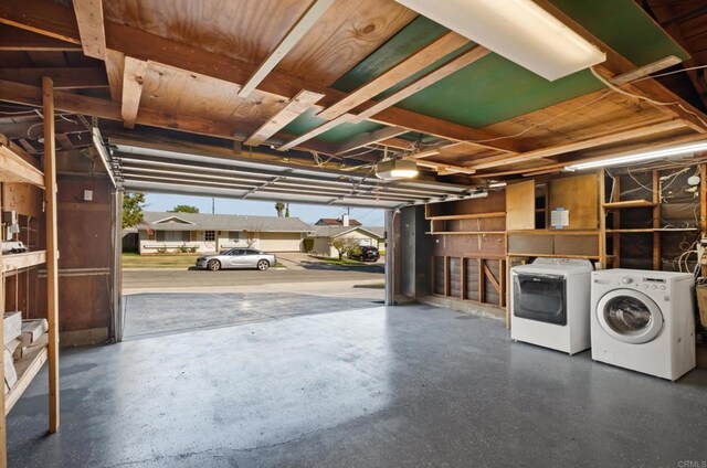 4158 Seri St, San Diego, CA 92117 - garage featuring washer and clothes dryer and a garage door opener