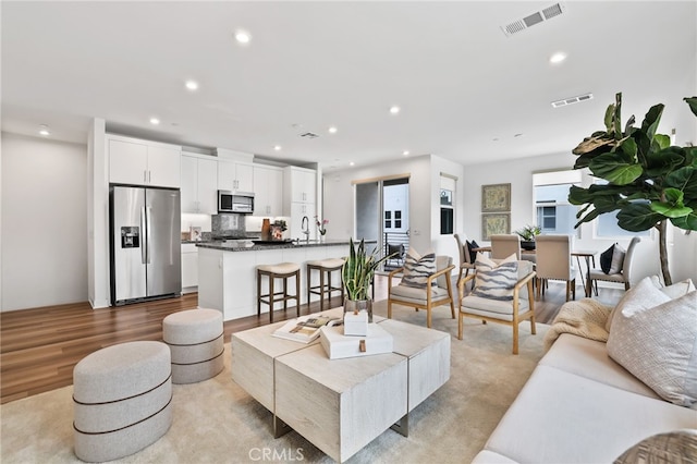 1914 W Bushell St, Anaheim, CA 92805 - living room featuring recessed lighting and wood finished floors