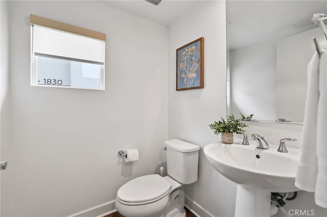 1914 W Bushell St, Anaheim, CA 92805 - half bath featuring toilet and baseboards