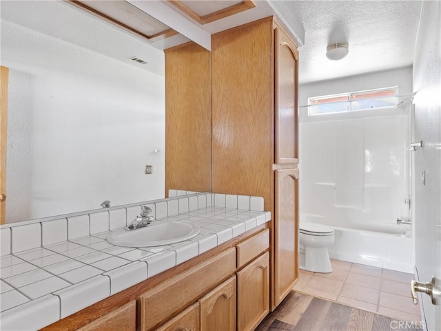 13951 Falling Leaf Rd, Apple Valley, CA 92307 - full bathroom with vanity, toilet, shower / bath combination, and wood finished floors