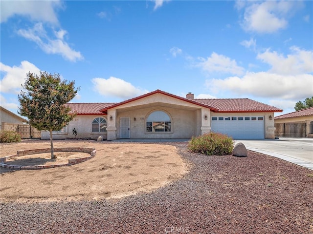 13951 Falling Leaf Rd, Apple Valley, CA 92307 - mediterranean / spanish house with stucco siding, a tile roof, and driveway