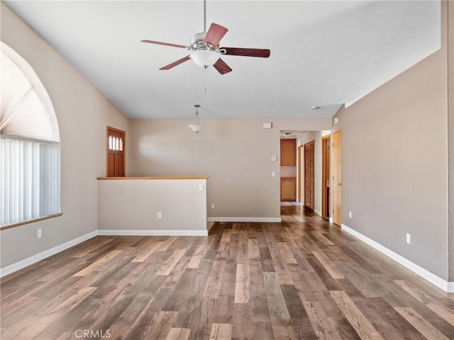 13951 Falling Leaf Rd, Apple Valley, CA 92307 - unfurnished living room with ceiling fan, wood finished floors, and baseboards