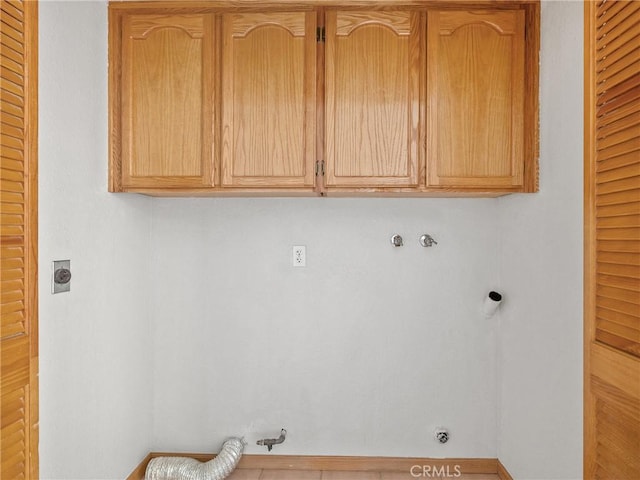 13951 Falling Leaf Rd, Apple Valley, CA 92307 - washroom featuring cabinet space, electric dryer hookup, hookup for a gas dryer, washer hookup, and baseboards
