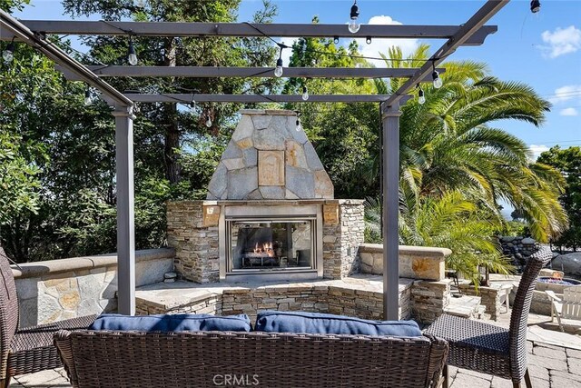 2212 Rim Rd, Duarte, CA 91008 - view of patio / terrace with a pergola and an outdoor living space with a fireplace
