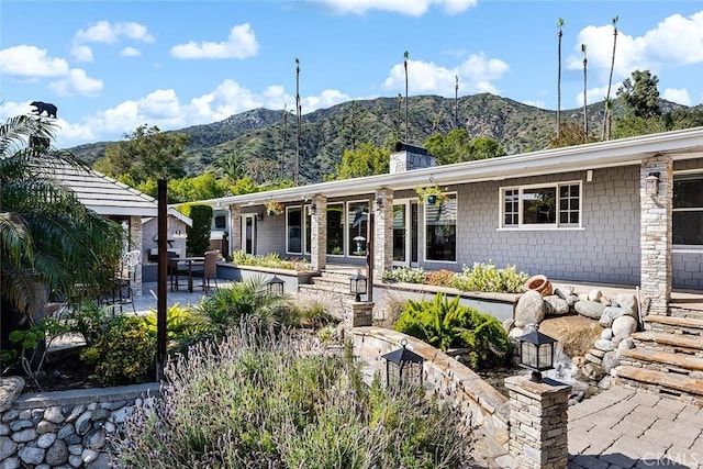 2212 Rim Rd, Duarte, CA 91008 - view of front of house with a mountain view and a patio