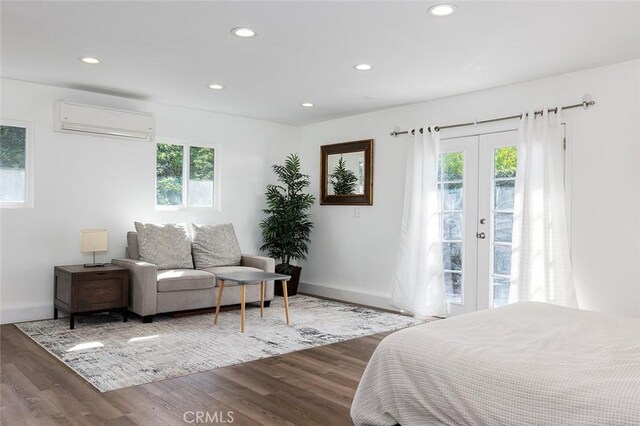 2212 Rim Rd, Duarte, CA 91008 - bedroom with a wall unit AC, wood finished floors, recessed lighting, access to exterior, and french doors