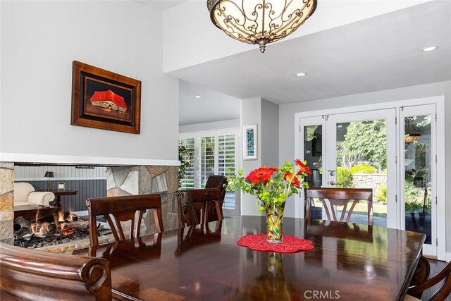 2212 Rim Rd, Duarte, CA 91008 - dining room featuring recessed lighting, a lit fireplace, and a chandelier