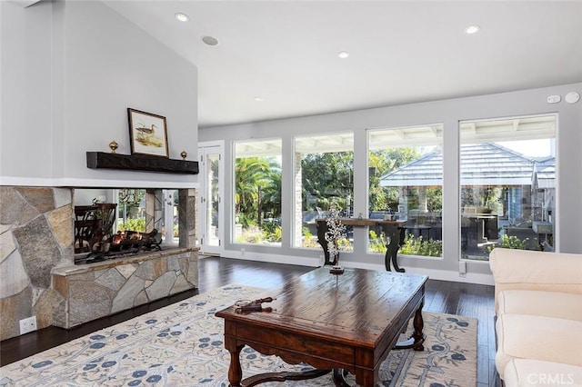2212 Rim Rd, Duarte, CA 91008 - living room with dark wood finished floors, recessed lighting, and a multi sided fireplace