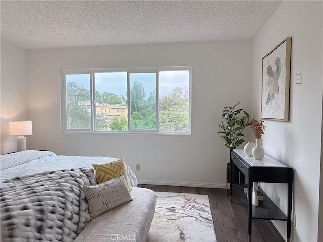 333 S Arroyo Dr Unit J, San Gabriel, CA 91776 - bedroom featuring wood finished floors, a textured ceiling, and baseboards