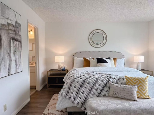 333 S Arroyo Dr Unit J, San Gabriel, CA 91776 - bedroom with wood finished floors, a textured ceiling, baseboards, and ensuite bath