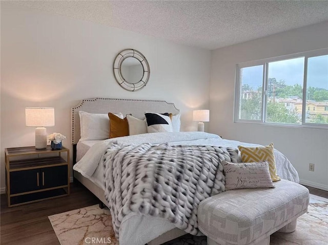 333 S Arroyo Dr Unit J, San Gabriel, CA 91776 - bedroom featuring wood finished floors, a textured ceiling, and baseboards