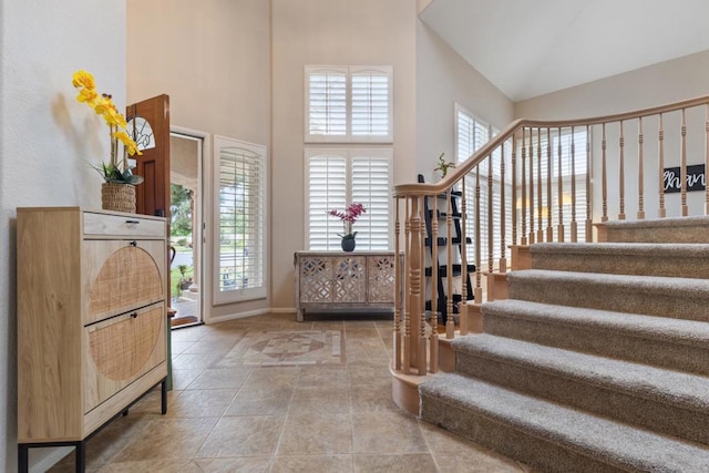 1394 Corte Magna, Oceanside, CA 92057 - foyer featuring a high ceiling, stairs, baseboards, and stone finish floors