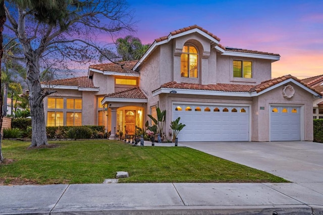 1394 Corte Magna, Oceanside, CA 92057 - mediterranean / spanish-style home with stucco siding, driveway, a front lawn, a tiled roof, and an attached garage