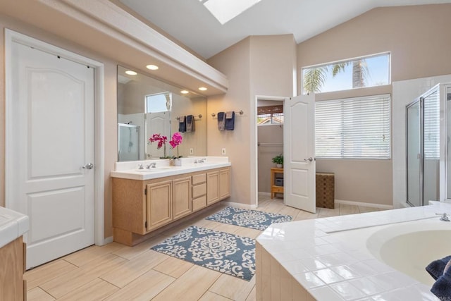 1394 Corte Magna, Oceanside, CA 92057 - full bathroom with double vanity, a shower stall, a bath, lofted ceiling, and plenty of natural light