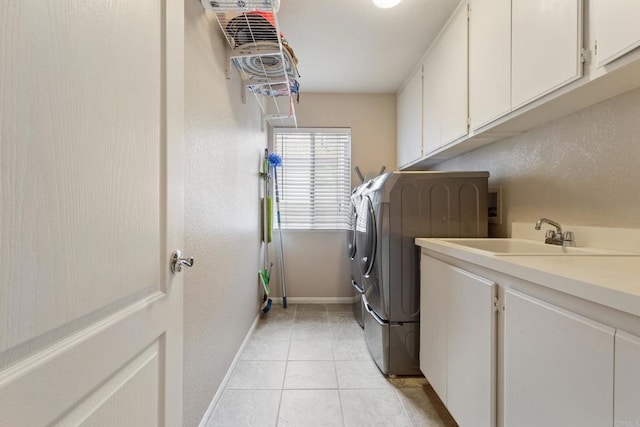 1394 Corte Magna, Oceanside, CA 92057 - laundry room with cabinet space, washer and clothes dryer, light tile patterned floors, and baseboards