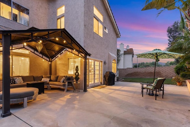 1394 Corte Magna, Oceanside, CA 92057 - patio terrace at dusk with french doors, a patio, an outdoor living space, and a gazebo