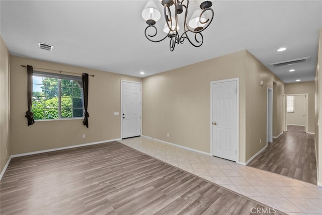 4616 W W Ave J2, Lancaster, CA 93536 - foyer entrance featuring wood finished floors, recessed lighting, baseboards, and a chandelier
