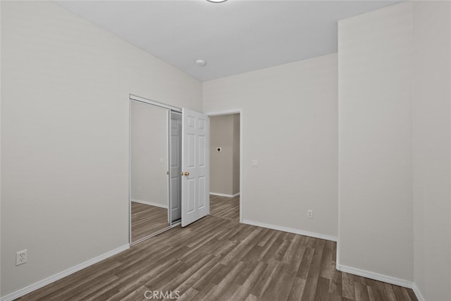 4616 W W Ave J2, Lancaster, CA 93536 - unfurnished room featuring dark wood-style flooring and baseboards