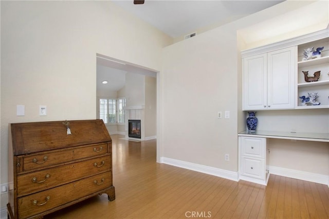 19 Byron Close, Laguna Niguel, CA 92677 - interior space with light wood-style flooring, built in desk, a fireplace with flush hearth, and baseboards