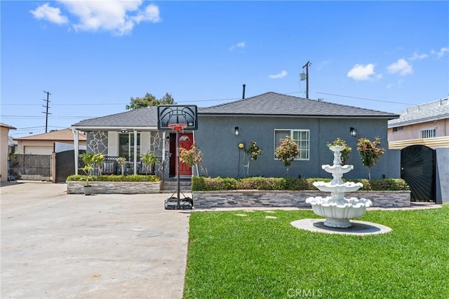 7321 Eglise Ave, Pico Rivera, CA 90660 - bungalow-style home featuring a gate, stucco siding, a shingled roof, and covered porch