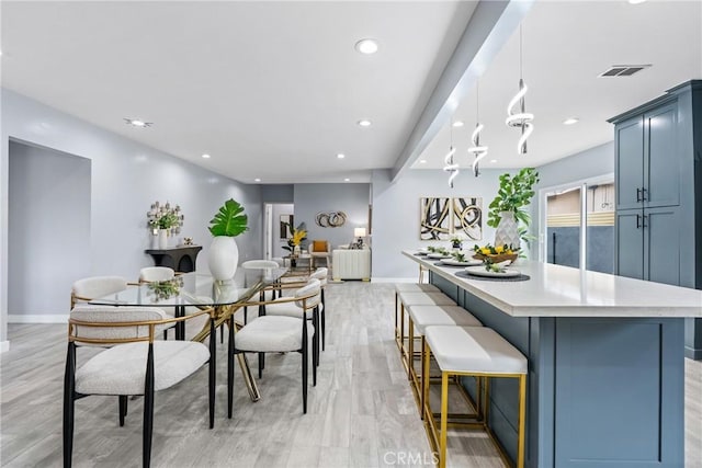7321 Eglise Ave, Pico Rivera, CA 90660 - dining area featuring light wood finished floors and recessed lighting