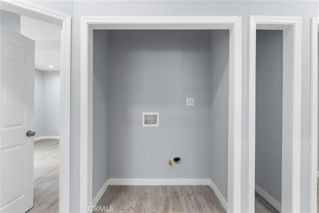 7321 Eglise Ave, Pico Rivera, CA 90660 - laundry area with light wood finished floors, hookup for a gas dryer, baseboards, and hookup for a washing machine