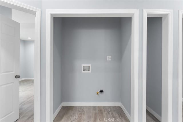 7321 Eglise Ave, Pico Rivera, CA 90660 - laundry area with light wood-style floors, gas dryer hookup, and hookup for a washing machine