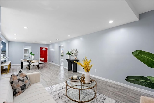 7321 Eglise Ave, Pico Rivera, CA 90660 - living area featuring wood finished floors and recessed lighting