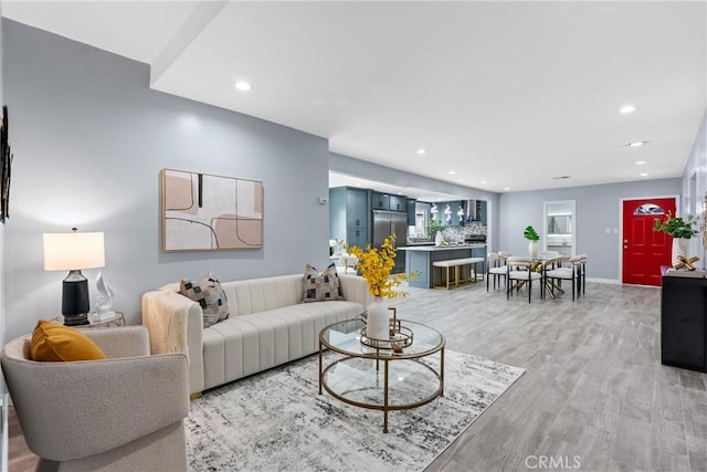 7321 Eglise Ave, Pico Rivera, CA 90660 - living room featuring light wood-style flooring and recessed lighting