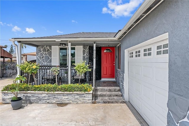 7321 Eglise Ave, Pico Rivera, CA 90660 - property entrance with a garage, a porch, and stucco siding