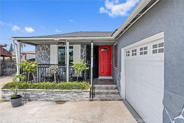 7321 Eglise Ave, Pico Rivera, CA 90660 - doorway to property featuring an attached garage, a porch, and stucco siding
