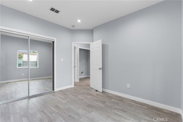 7321 Eglise Ave, Pico Rivera, CA 90660 - unfurnished bedroom with wood finished floors, baseboards, a closet, and recessed lighting