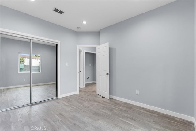 7321 Eglise Ave, Pico Rivera, CA 90660 - unfurnished bedroom featuring light wood finished floors, a closet, and recessed lighting