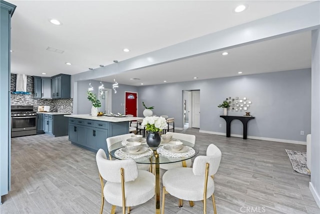 7321 Eglise Ave, Pico Rivera, CA 90660 - dining room with baseboards, light wood-type flooring, and recessed lighting