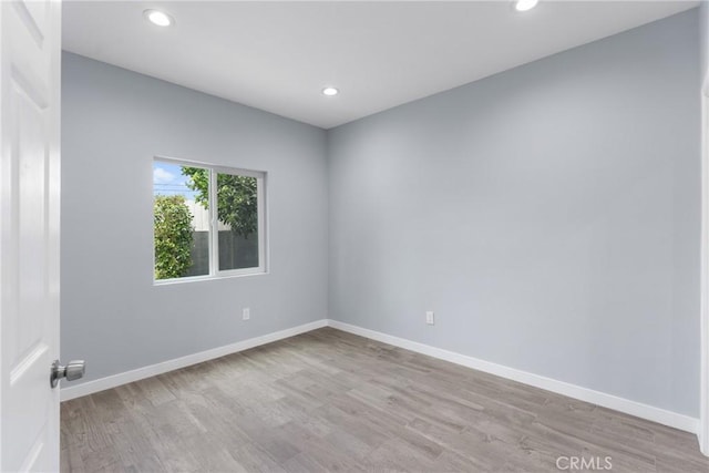 7321 Eglise Ave, Pico Rivera, CA 90660 - empty room featuring wood finished floors, recessed lighting, and baseboards